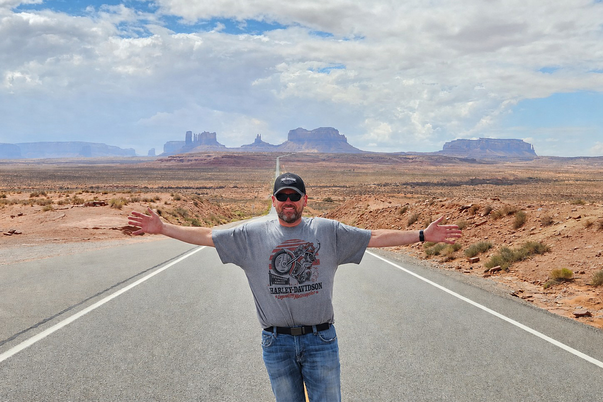 Kyle DeBoer posing for a photo in the desert.